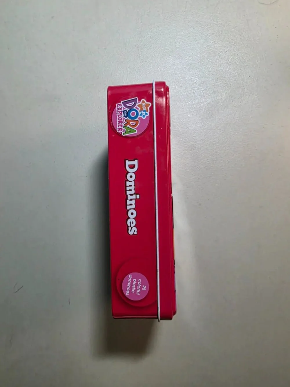 Nick Jr. Dora the Explorer Dominoes Game in Collectible Tin – 28 Plastic Pieces